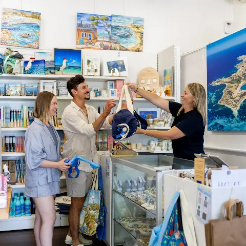 A couple hiring beach equipment from Rottnest Rentals.